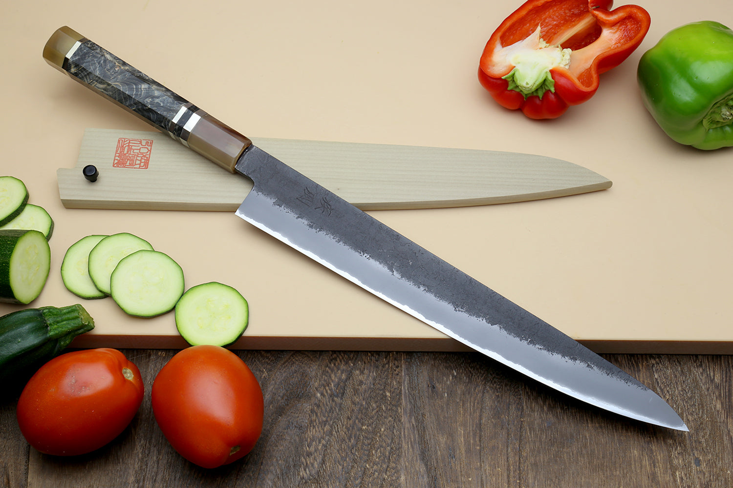 Yoshihiro sujihiki slicing knife on a wooden cutting board