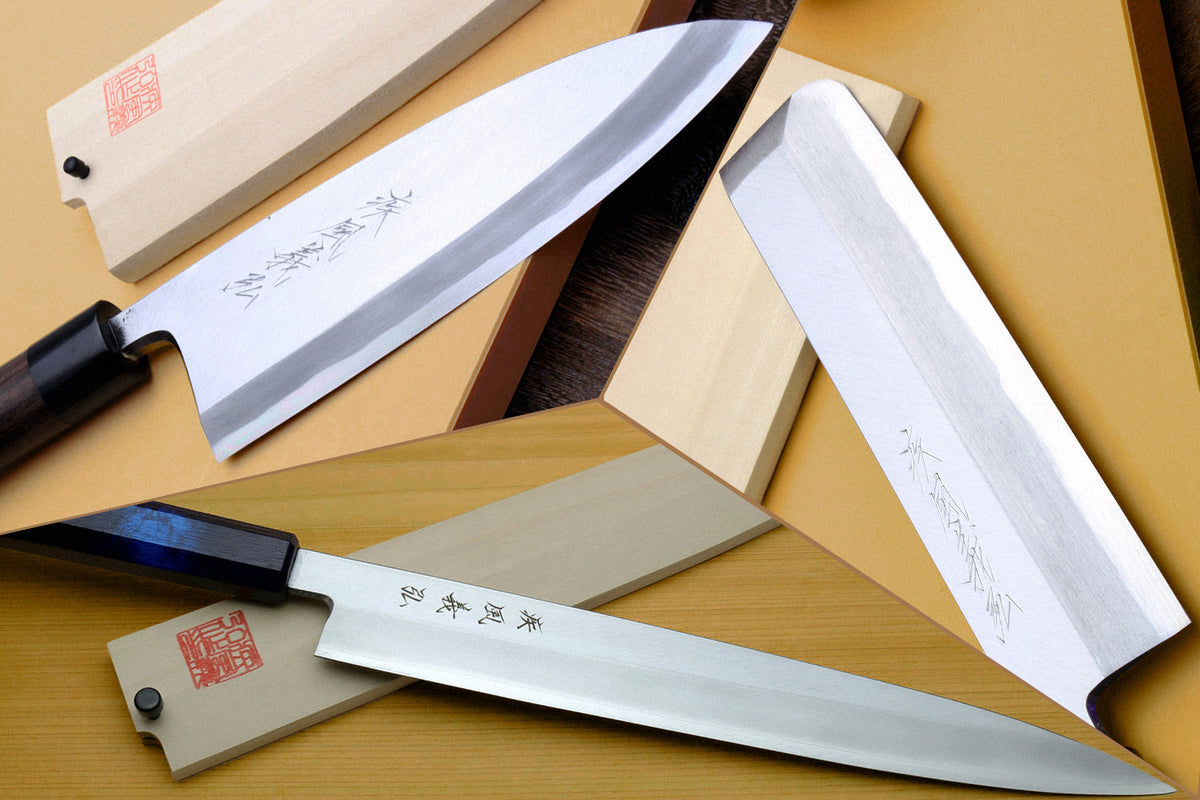 Three single-bevel Japanese knives arranged together