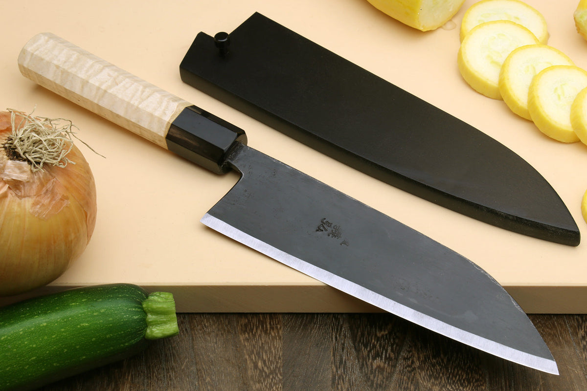 Japanese santoku knife on a cutting board