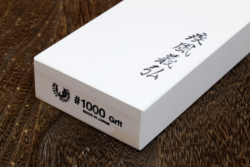 1000-grit whetstone sharpening stone block, white, no base; shows #1000 Grit