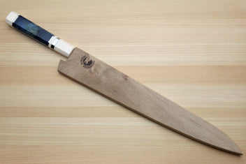 Sujihiki slicing knife with blue stabilized handle and wooden saya on light wood