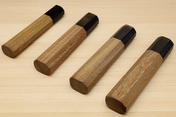 Gyuto chef knife handles with ebony bolsters and ambrosia wood grips, angled shots