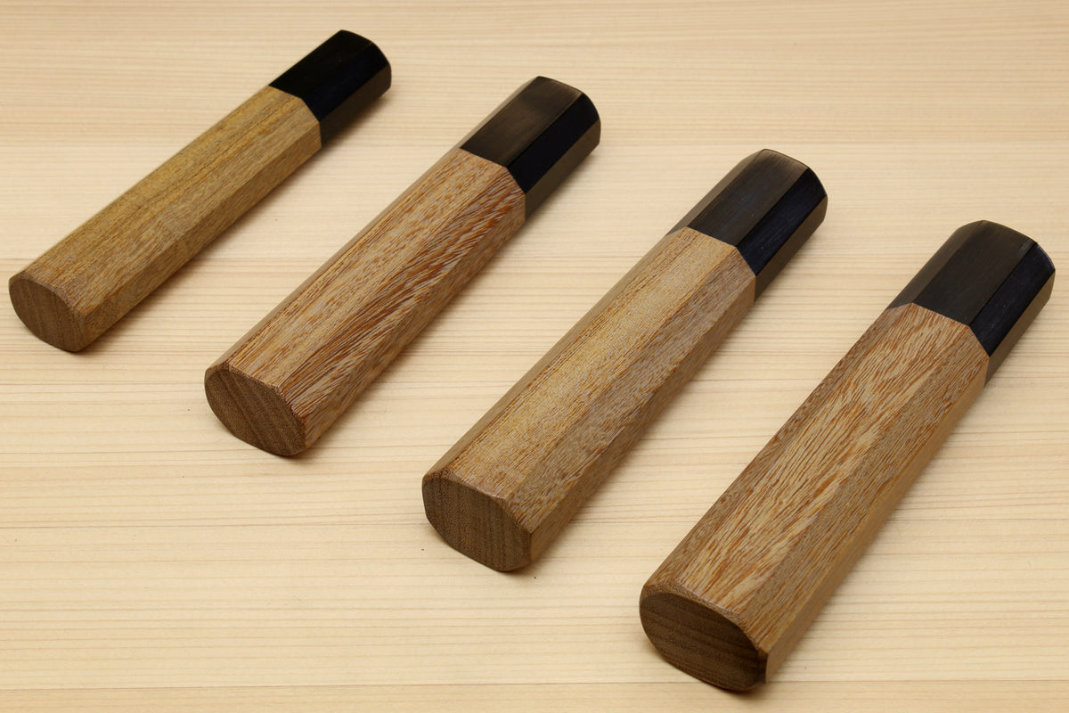 Wooden knife handles with dark ebony bolster caps, ambrosia wood, angled view, for Petty knives
