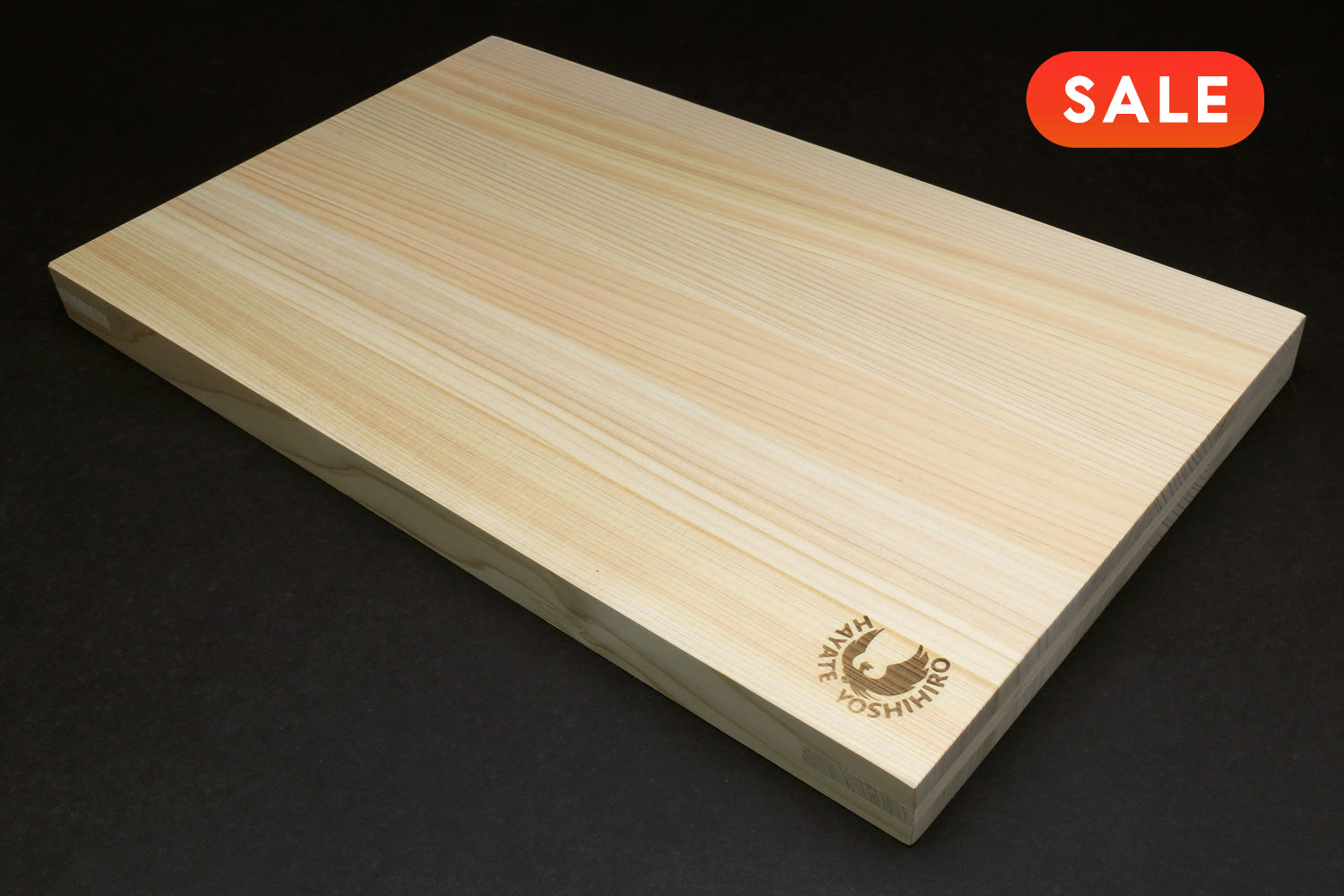 Japanese Cypress Wooden cutting board with a brand logo on a black background, featuring a 'SALE' label.