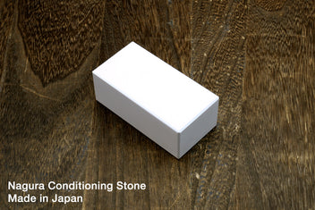 Conditioning stone block with white top and gray sides, rectangular