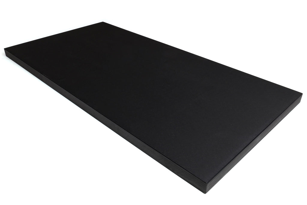 Long black soft cutting board, flat rectangle shown at an angle