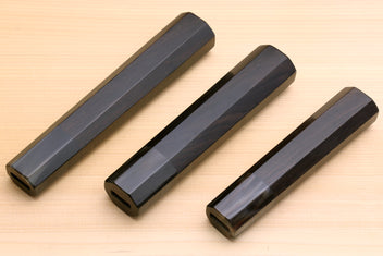 Four ebony knife handle blanks with dark horn bolsters, top view, for Sujihiki knives