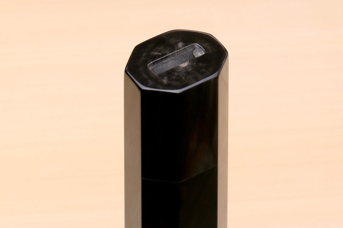 Horn bolster end on an ebony knife handle, faceted cut, for Sujihiki knives