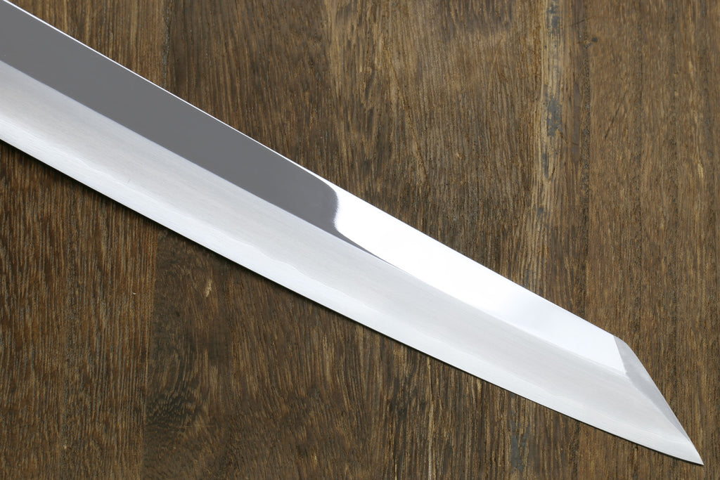 Knife blade on a wooden surface