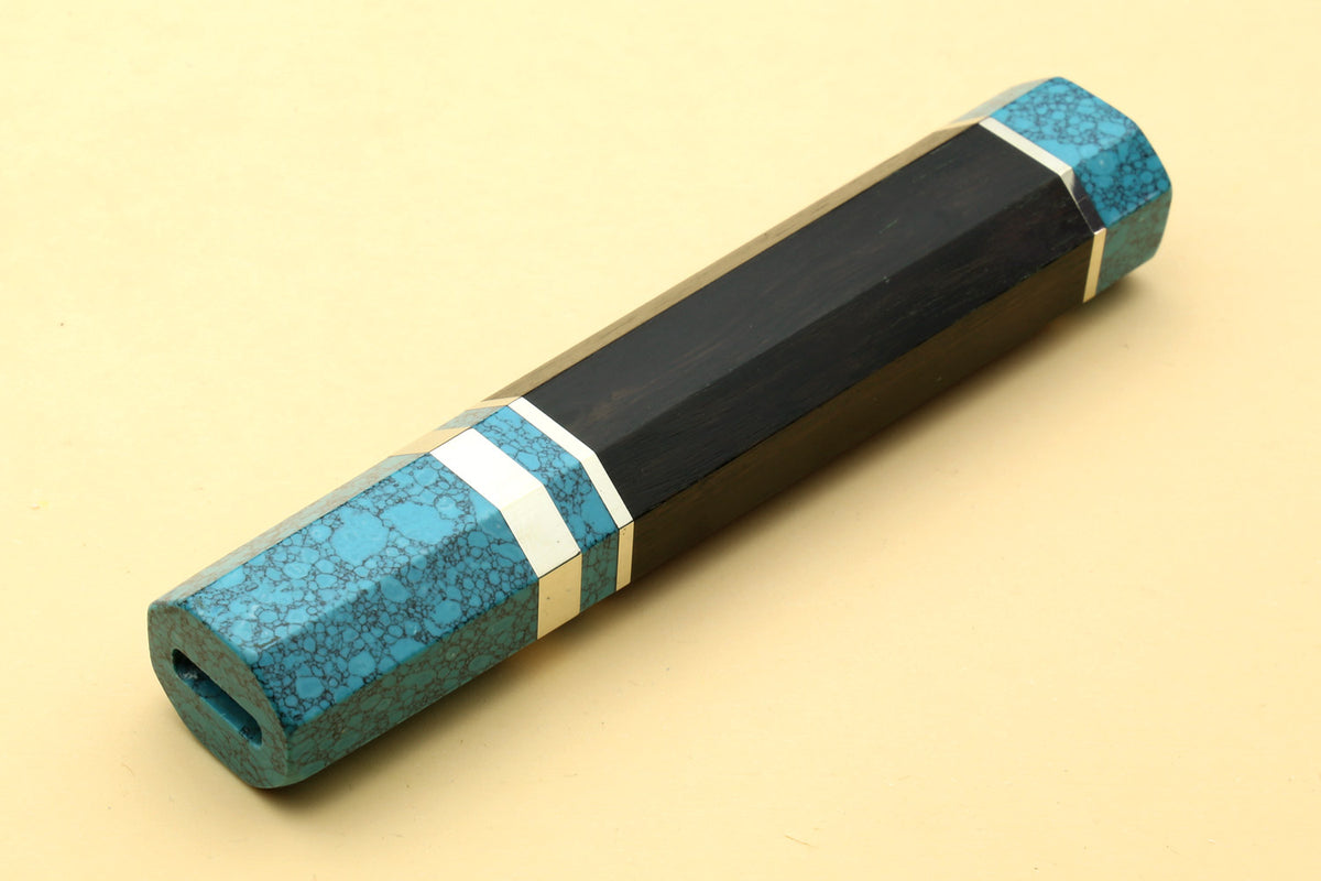 Turquoise-blue knife handle with black core and white stripe, angled view, for Gyuto knives