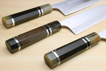 3-piece knife set with dark octagonal wood handles and triple-ring accents