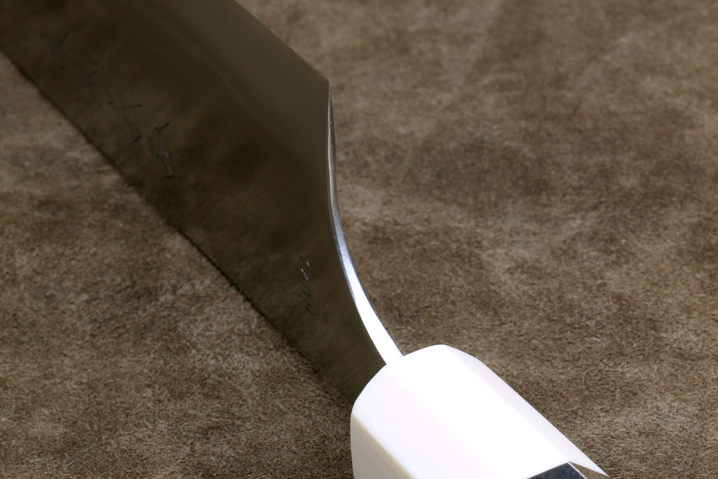 Knife heel on a brown rug