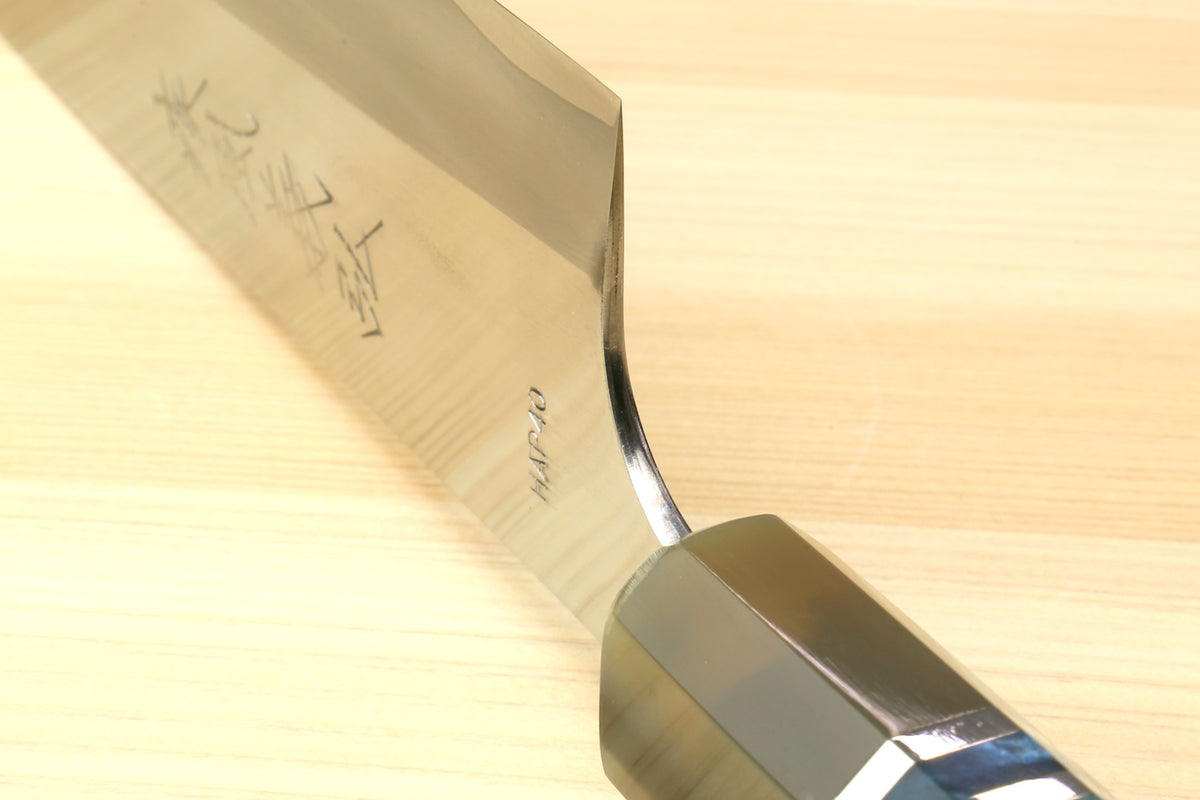 Gyuto chef's knife with blue patterned handle and curved blade heel