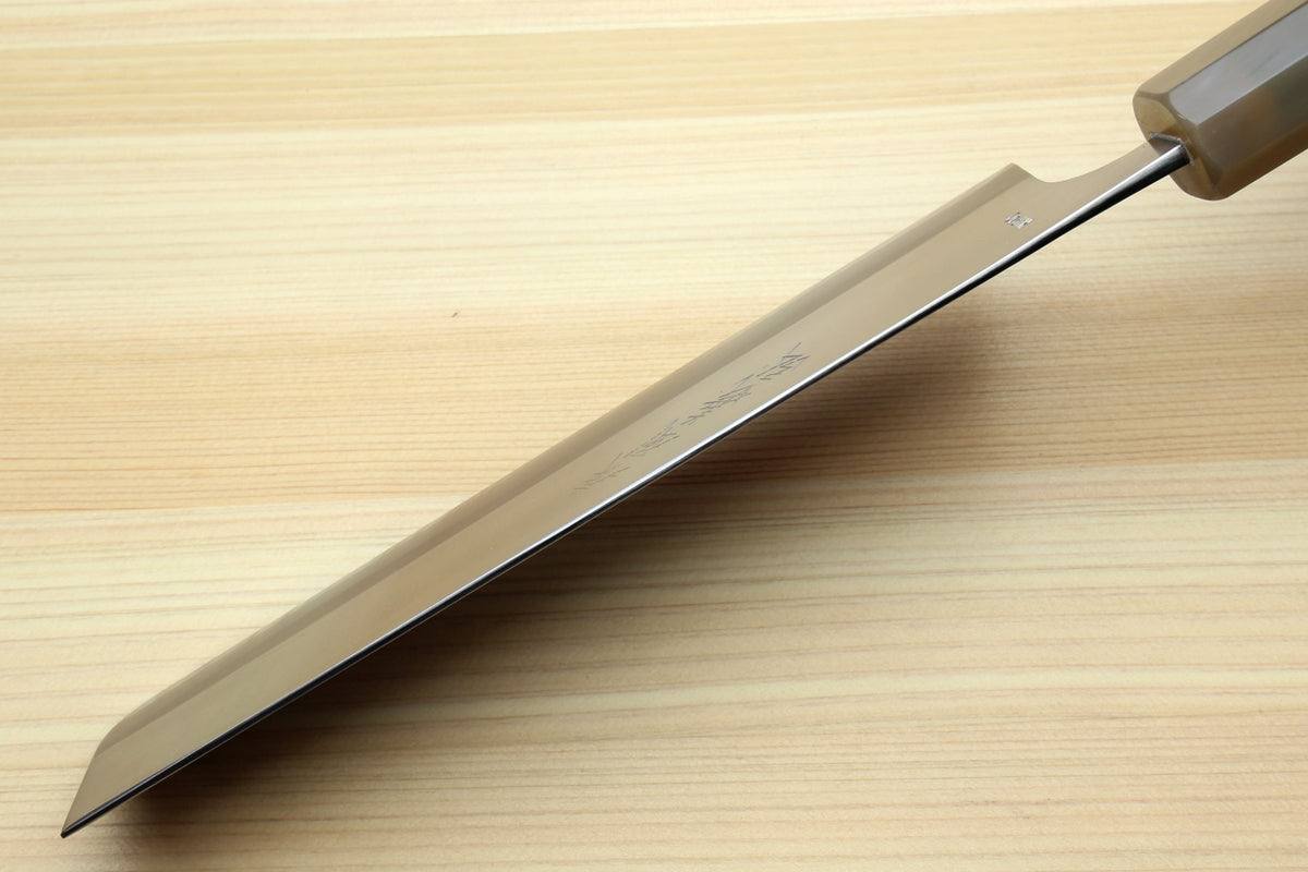 Nakiri knife blade with stamped logo on the side, steel finish, dark patterned handle