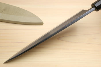 Japanese sushi and sashimi knife, silver blade with black bolster on light wood handle