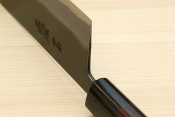 Nakiri knife tip and spine view with rounded cutting corner and dark wood handle