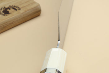 Japanese gyuto knife blade tip and ivory bolster with dark handle section