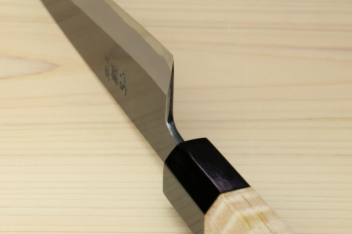 Petty utility knife with dark blade and light wood handle, black bolster at the tang