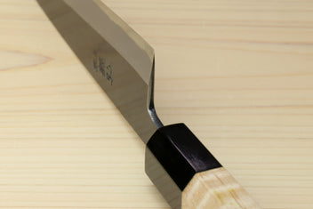 Petty utility knife with dark blade and light wood handle, black bolster at the tang