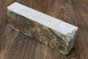 Natural sharpening whetstone rectangular block, speckled brown-gray face and pale side