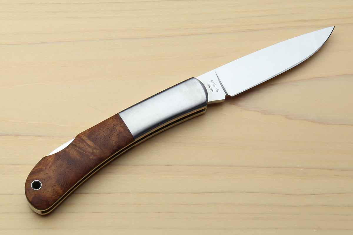 Polished stainless folding pocket knife with brown wood handle, lockback blade