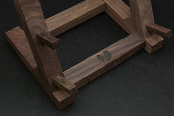 Ebony and rosewood knife rack stand close-up of wooden frame and slot openings