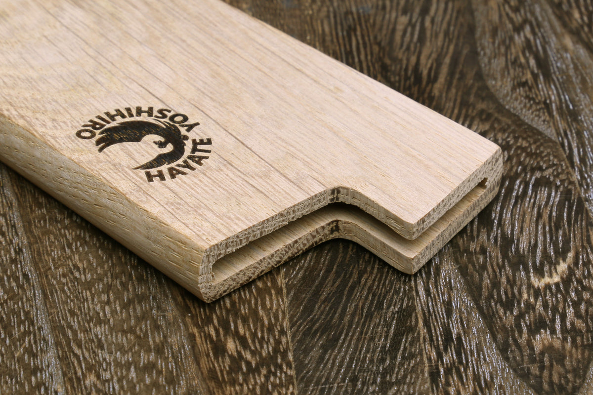 Light oak saya cover end with carved channel and logo, showing interior fit