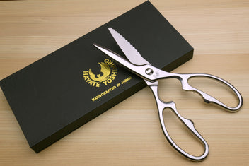 Stainless steel Japanese multi-use kitchen shears beside Yoshihiro box.