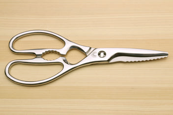 Stainless steel Japanese kitchen shears with straight and scalloped grip cutting edges and loop handles.