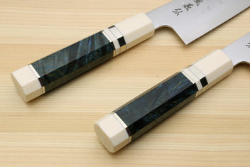 Kiritsuke chef's knife with ocean blue handle scales and white bolster with black accents