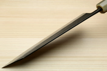 Kiritsuke chef knife blade with dark handle, pointed tip and silver cutting edge