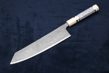 Japanese chef knife with silver damascus blade and white handle with dark band