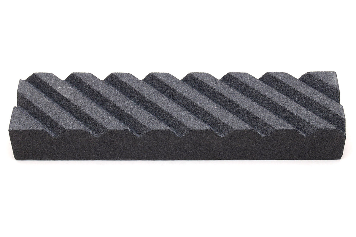 Sharpening stone fixer, black ribbed wedge block with stepped ridges