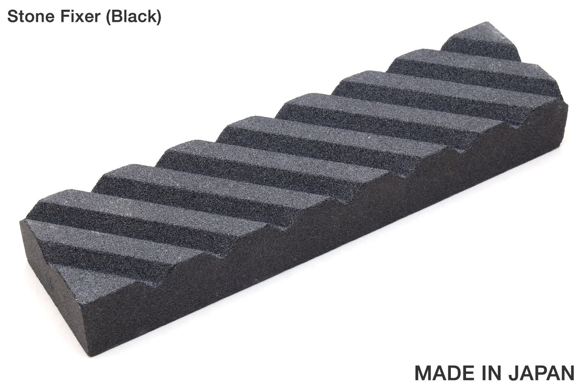 Black stone fixer with striped abrasive surface, rectangular sharpening block