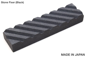 Black stone fixer with striped abrasive surface, rectangular sharpening block