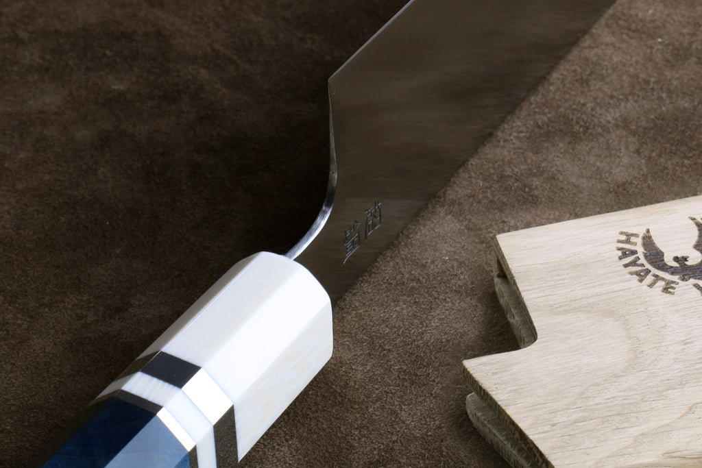 Knife heel on a brown leather surface