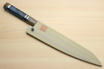 Chef gyuto knife on board with ocean blue octagonal handle and grey Damascus blade