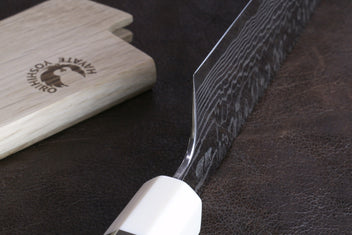 Damascus gyuto chef knife with ivory octagonal handle and teal bolster, heel detail
