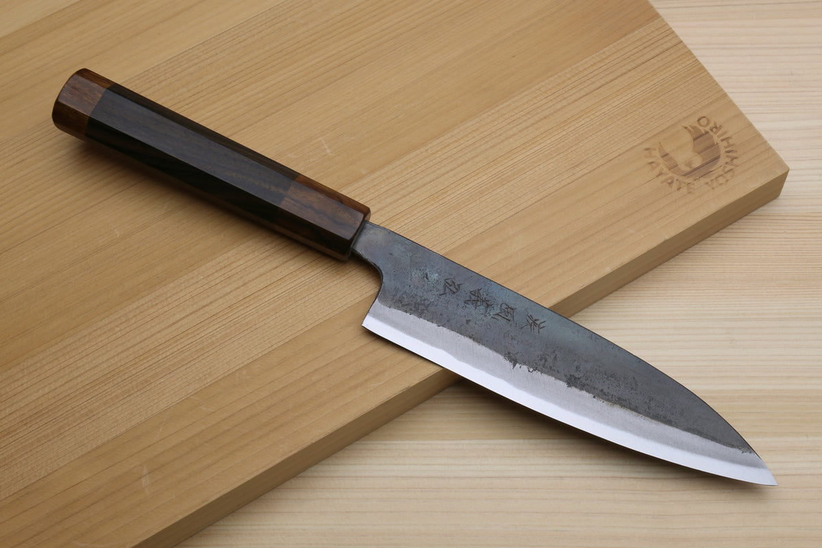 Petty utility knife with dark ebony handle and blue-gray kurouchi steel blade