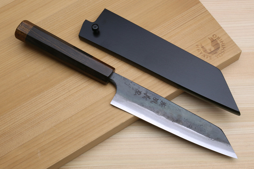Utility knife with kurouchi-finished blade and ebony handle, shown with saya cover