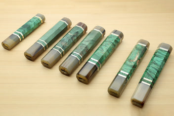 Assorted green burl knife handles with horn bolsters and white striped collar bands, for Gyuto knives