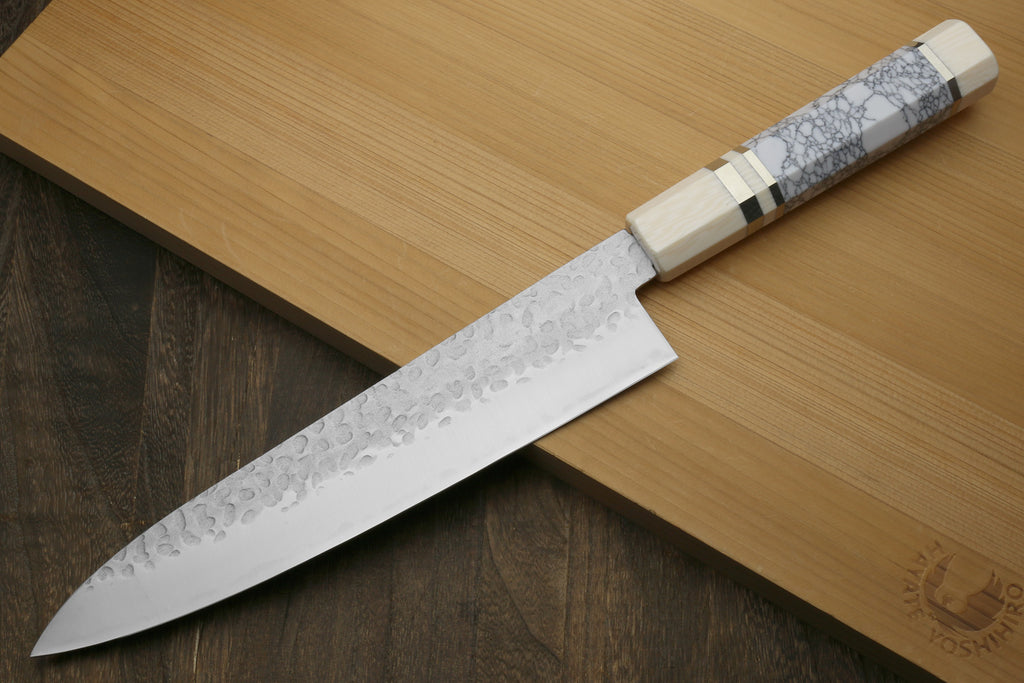 Backside of knife with pretty white handle
