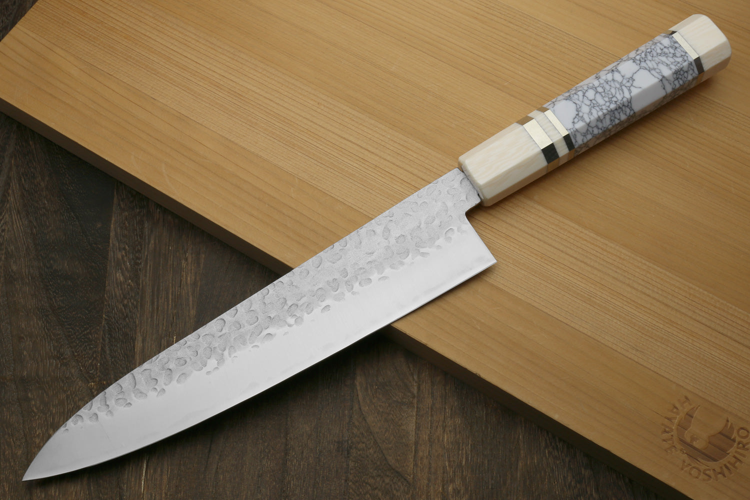 Backside of knife with pretty white handle