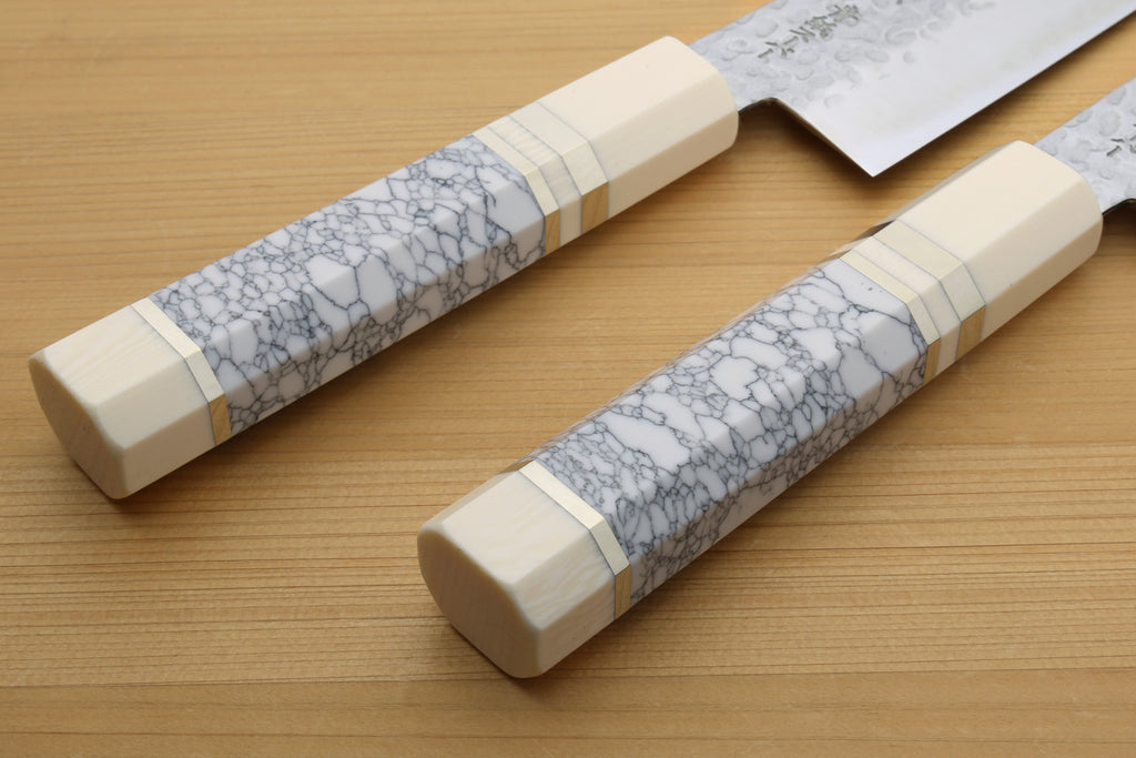 Two handles on a wooden surface