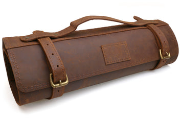 Brown natural leather knife roll bag with flap and two buckled closure straps