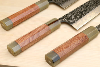 Damascus nakiri knives with ironwood handles and dark patterned blades