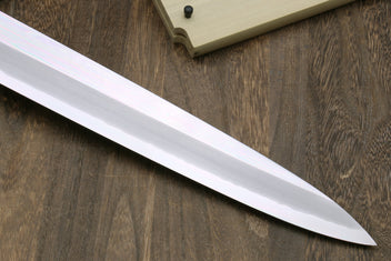 Tuna knife blade close-up with mirror finish and pointed tip