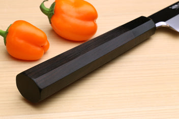 Yanagi kiritsuke knife with dark handle and mirror-polished blade