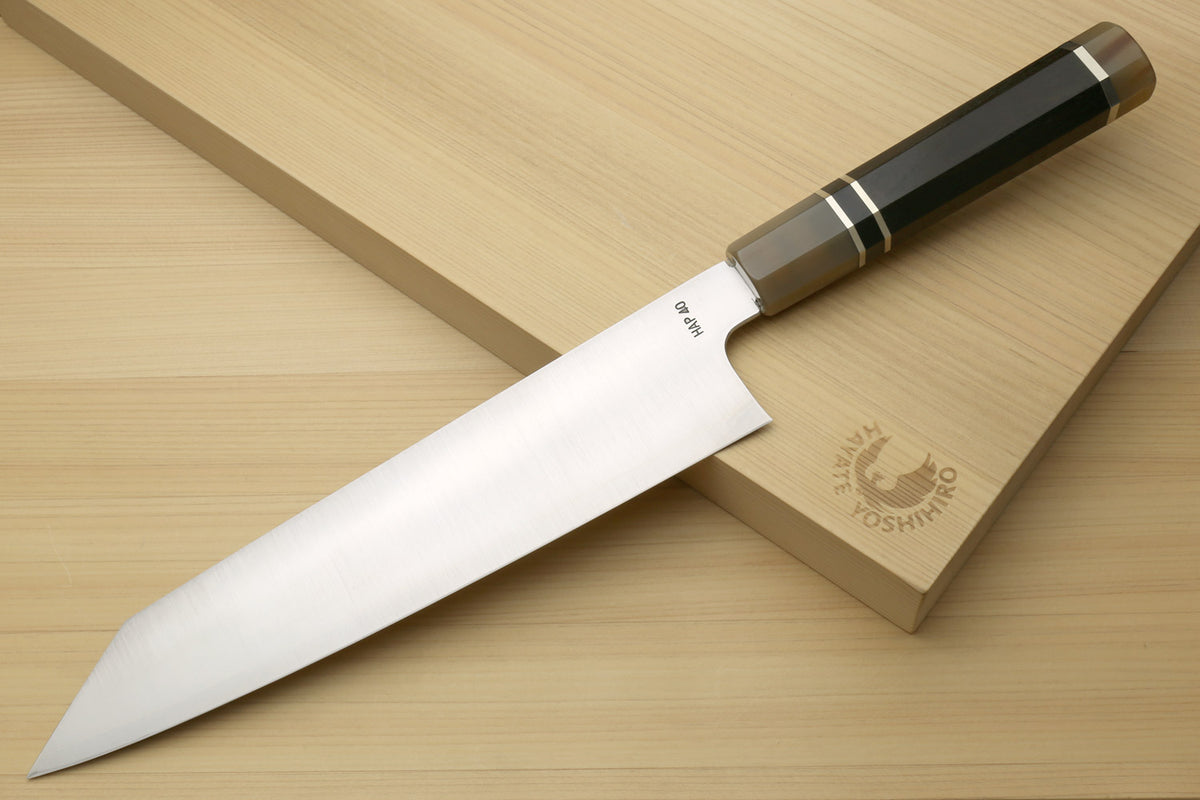 Kiritsuke chef knife with white steel blade and dark ebony handle, side view