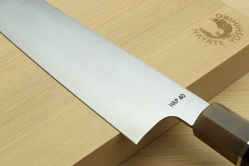 Kiritsuke chef knife edge and handle close-up with “HAP 40” marking